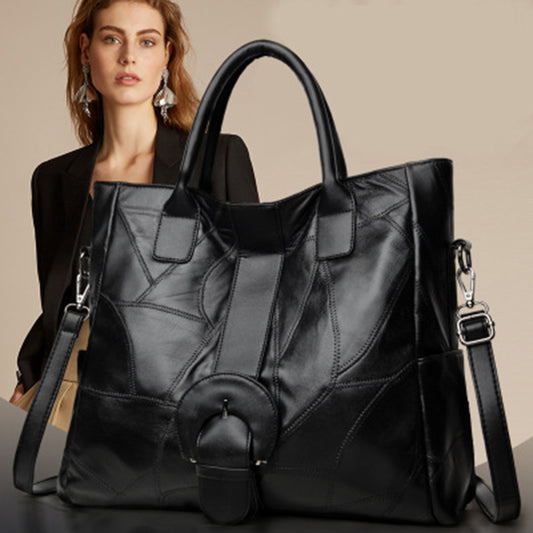 Woman behind an up-close displaying Genuine Leather Large Capacity Handbag