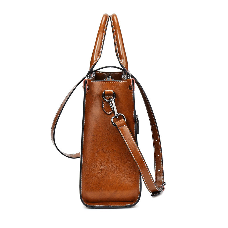 Side view of the Oil Wax Stitch Leather Handbag in khaki.