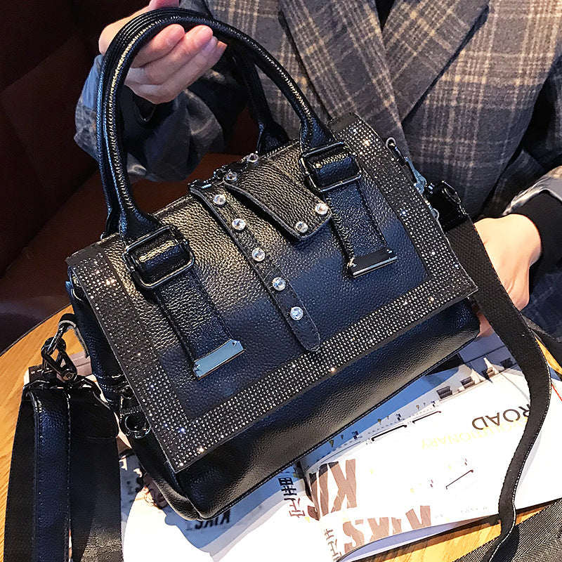 Up close view of model posing the  Large Capacity Leather Rhinestone Handbag.