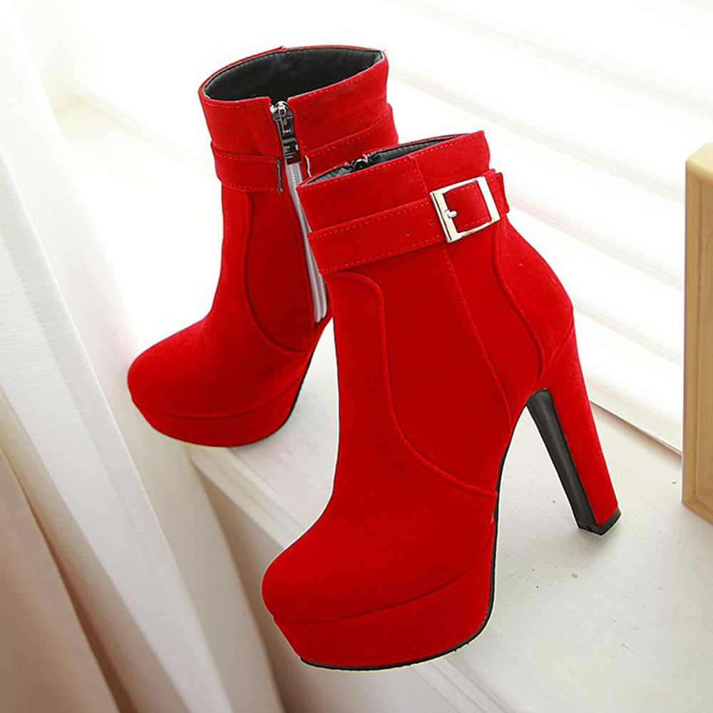 Platform Buckled Ankle Boots paired in red.