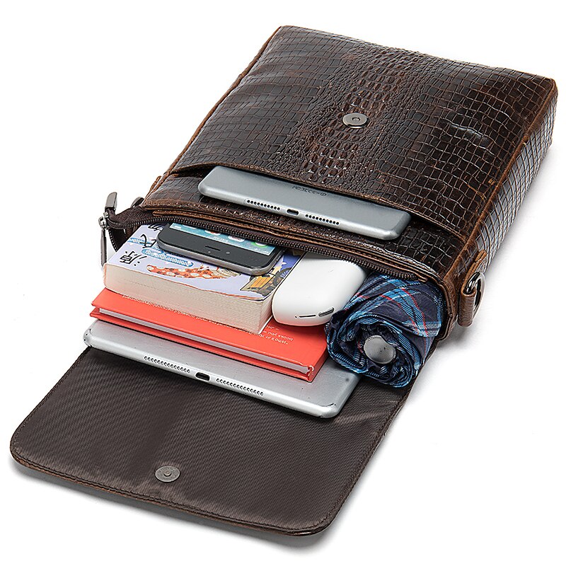 Image displaying various items inside of the inside of the Vintage Genuine Leather Messenger Bag.