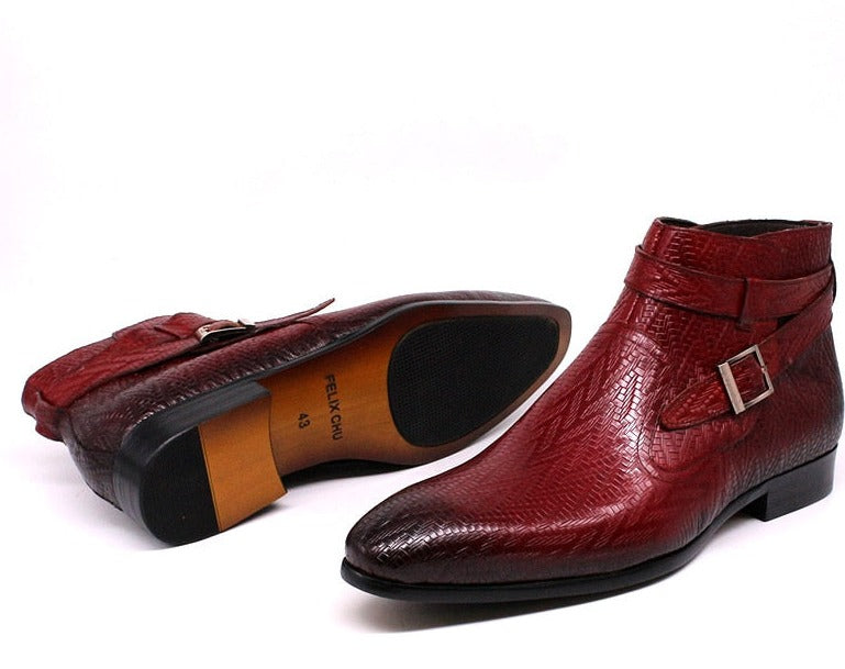 Men Genuine Leather Ankle Boots in red with one boot laying on its side.