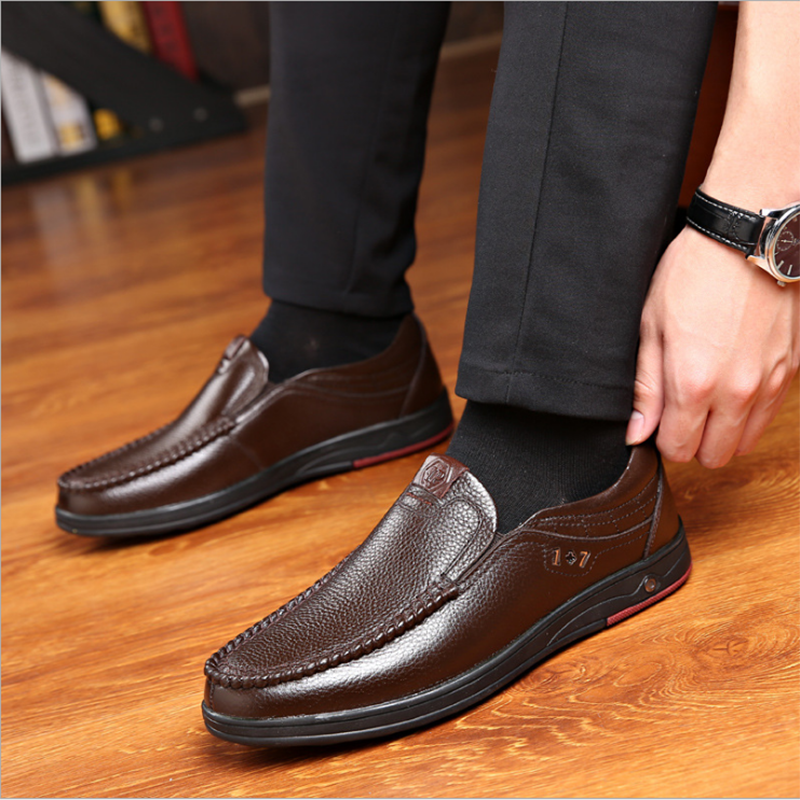 Business Casual Leather Loafers in brown worn by a shoe model.