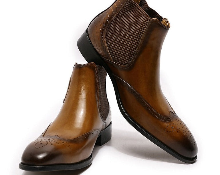 Men's Genuine Leather Causal Ankle Boots one positioned with its heel on top of the other boot.